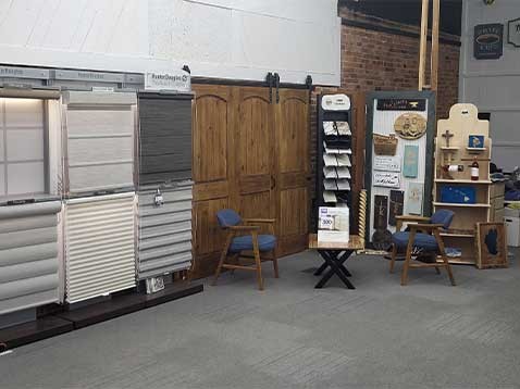 Store interior showcasing several different types of window coverings