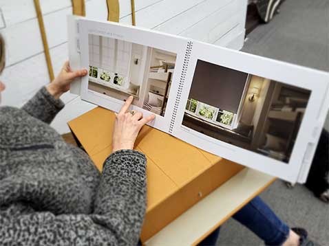 Over-the-shoulder view of a woman looking at a book